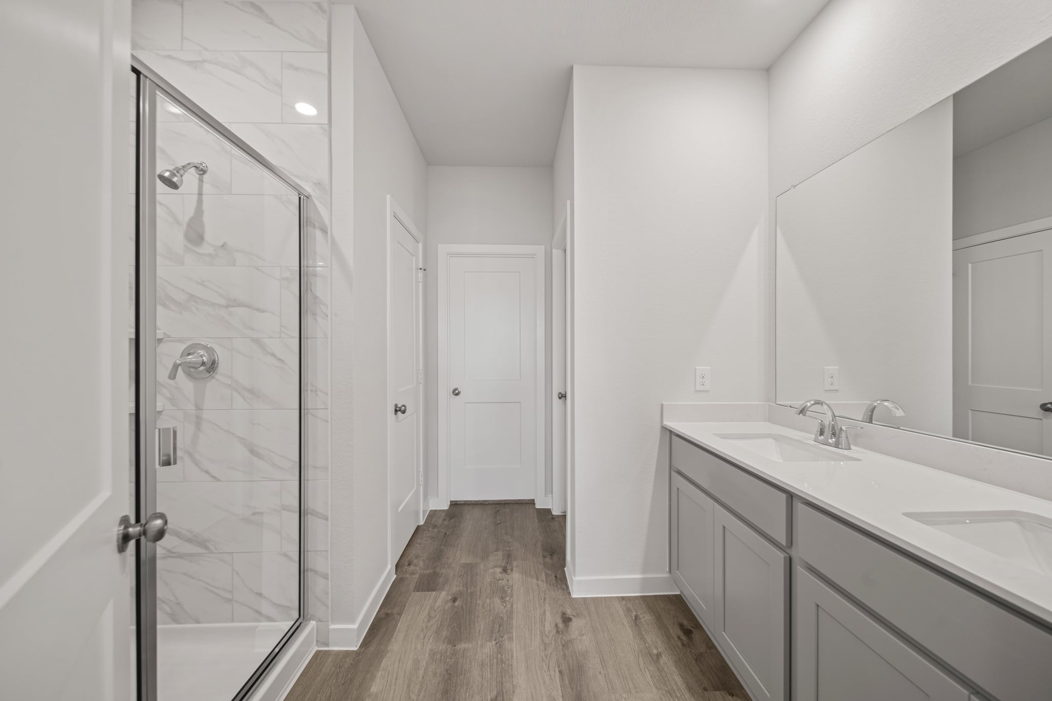 A bathroom with a glass shower.