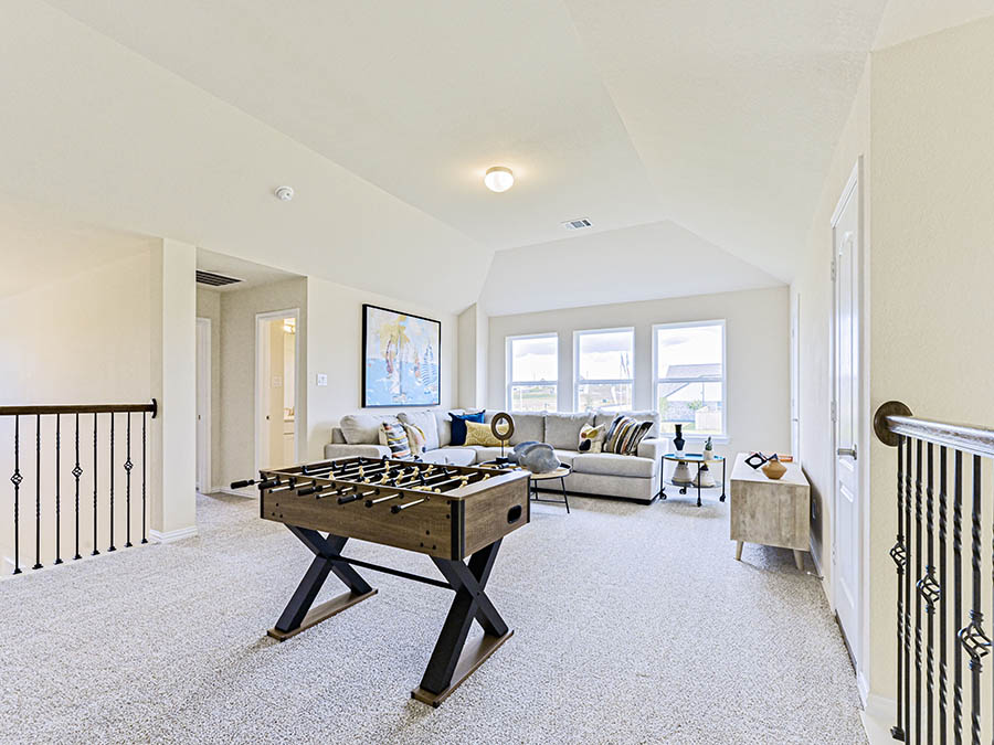A living room with a couch and a table.