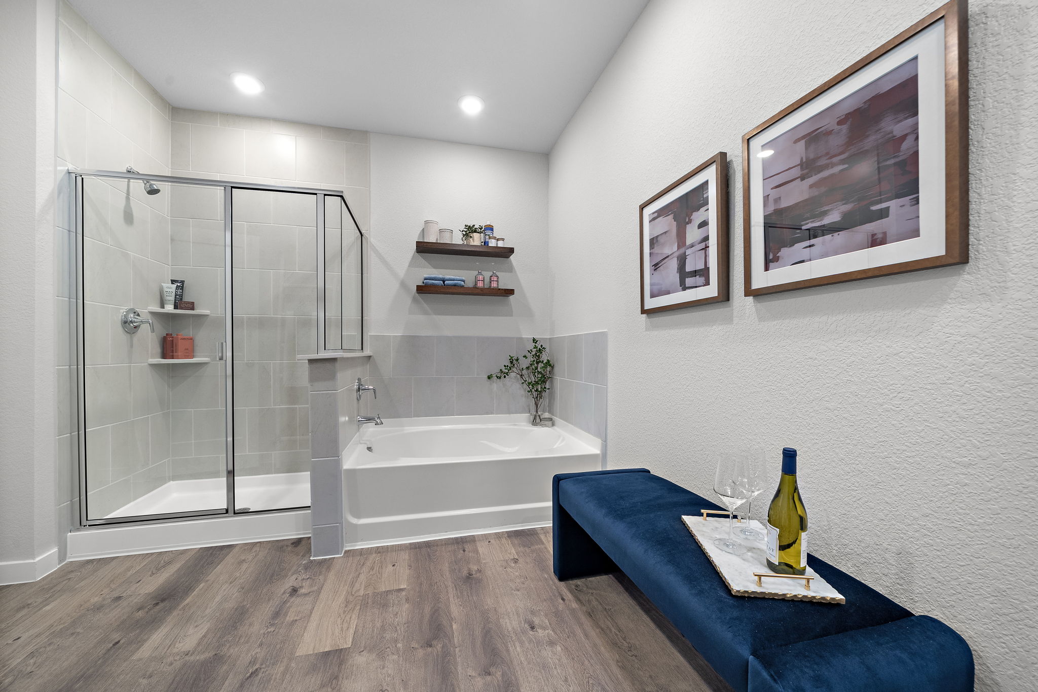 A bathroom with a bathtub and a bench.
