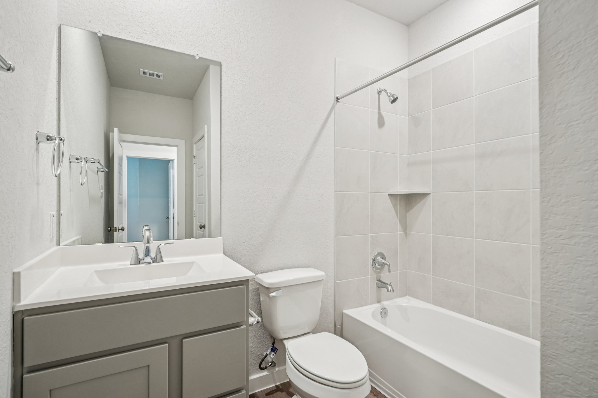 A bathroom with a toilet and sink.