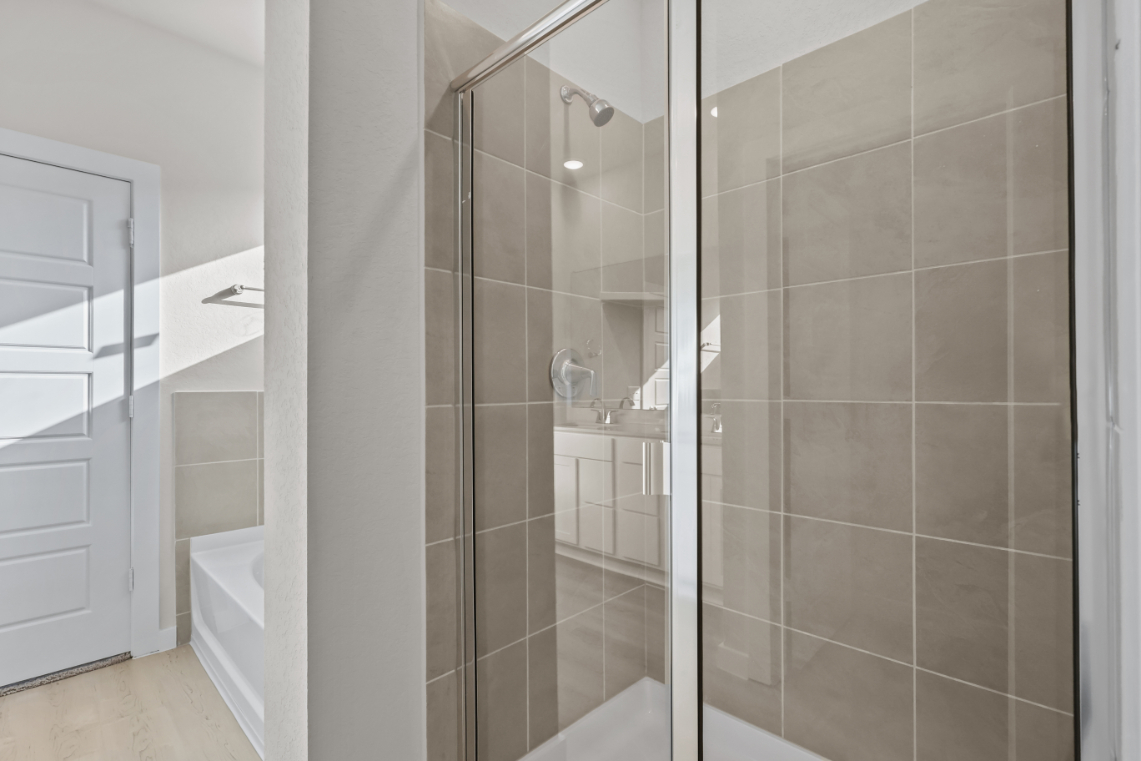 A bathroom with a glass shower.