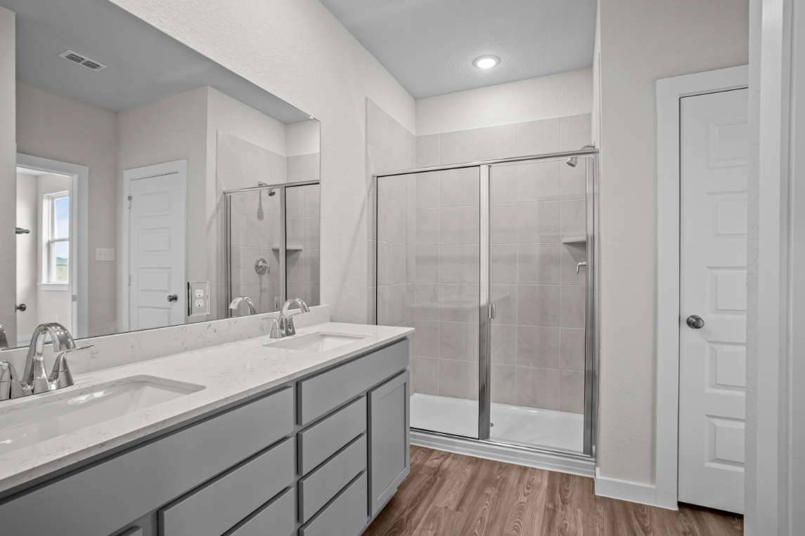A bathroom with a glass shower.