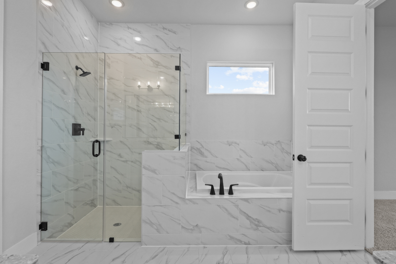 A bathroom with a glass shower.