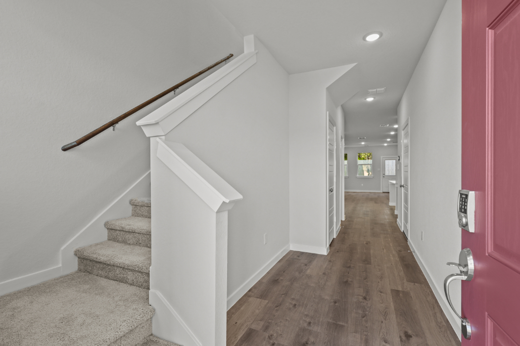A hallway with white walls.
