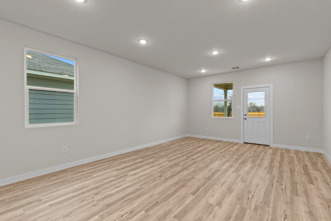 A room with a wood floor and a wood floor.