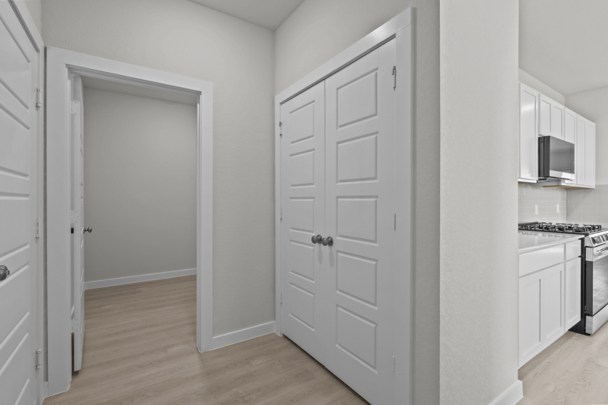 A room with white cabinets.