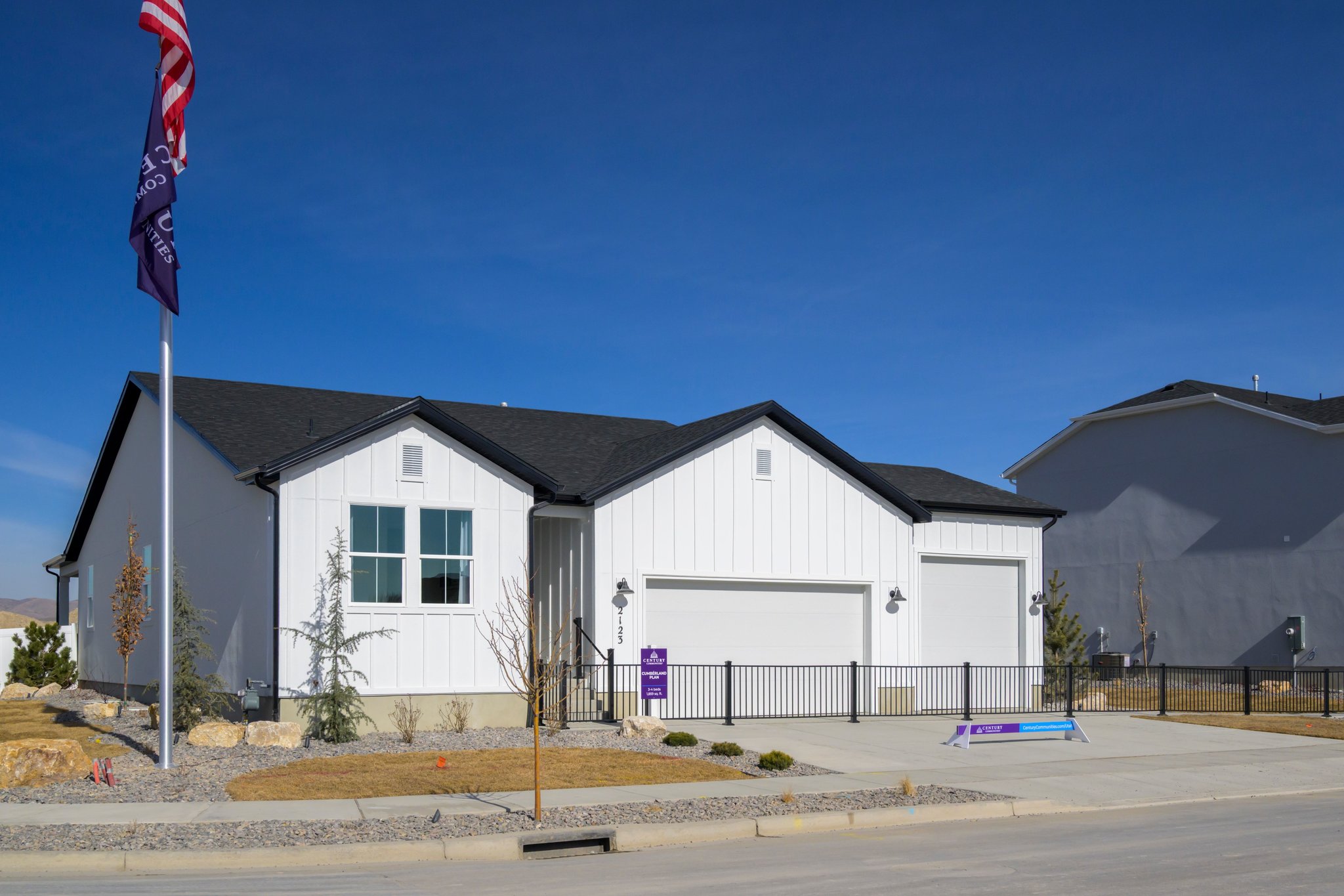 A house with a flag in front.