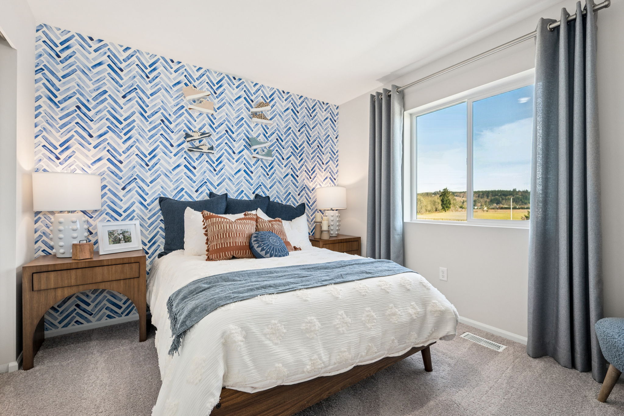 A bedroom with a blue wall.