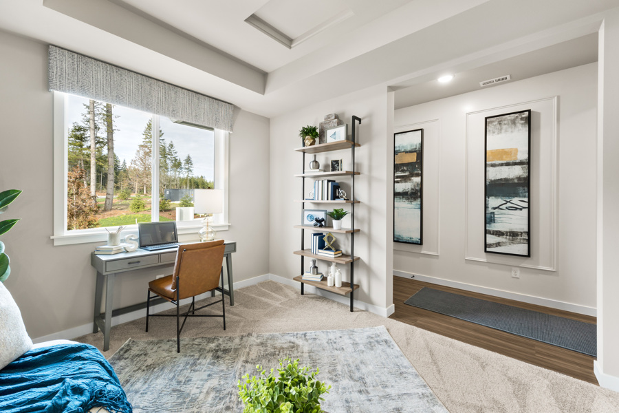 A room with a desk and a chair.