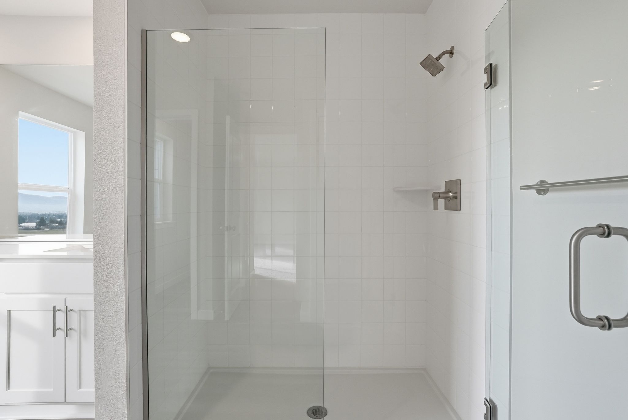 A bathroom with a glass shower.
