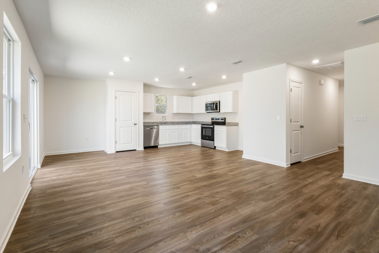 A large kitchen with white cabinets.