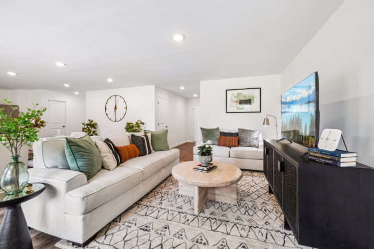 A living room with a couch and a coffee table.