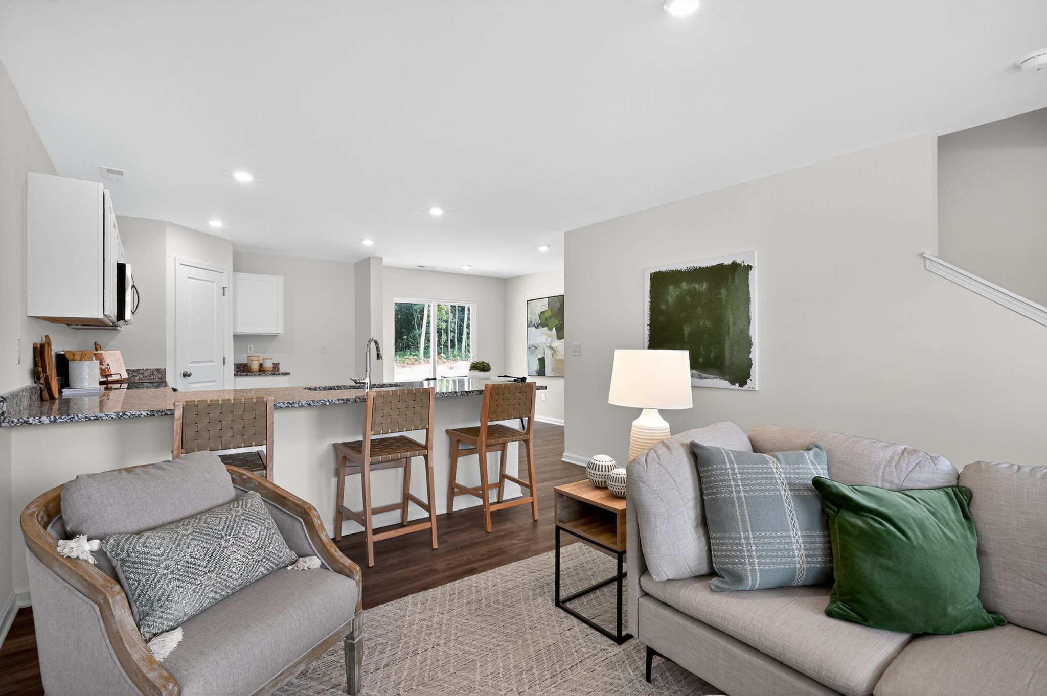 A living room with a dining table and couches.