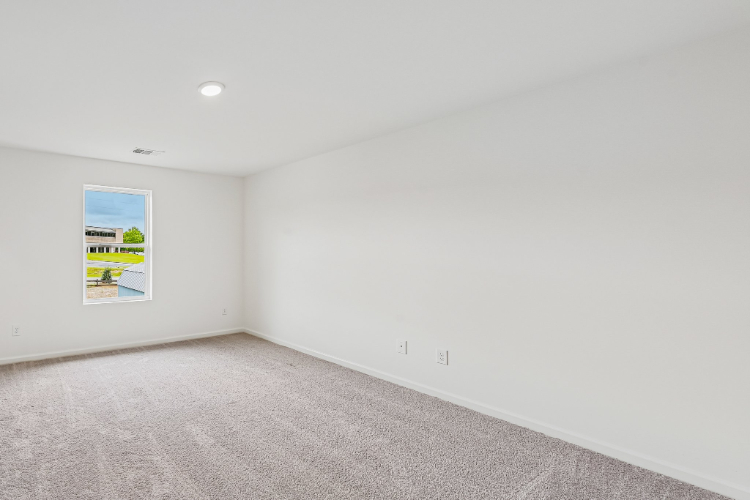 A white wall with a poster on it.