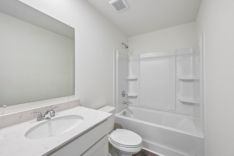 A bathroom with a sink and a toilet.