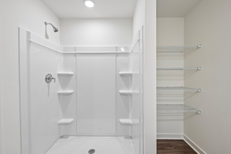 A bathroom with a glass shower.