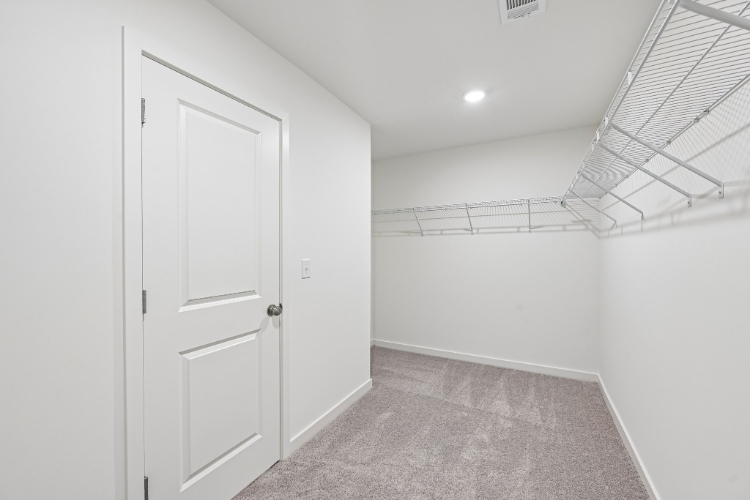 A hallway with white doors.
