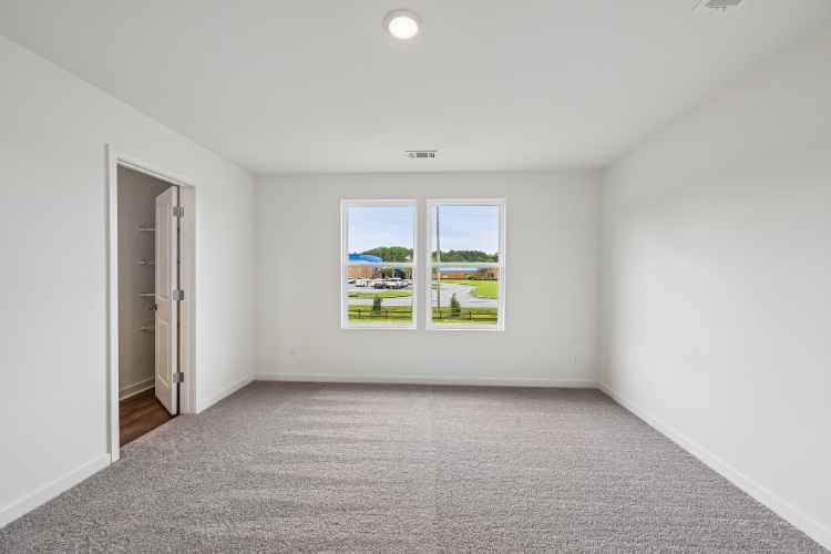 A room with a few windows.