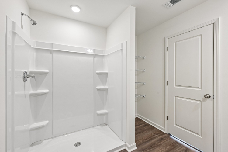 A bathroom with a tub and sink.