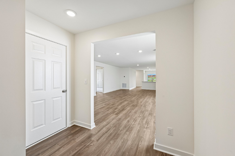 A hallway with white doors.
