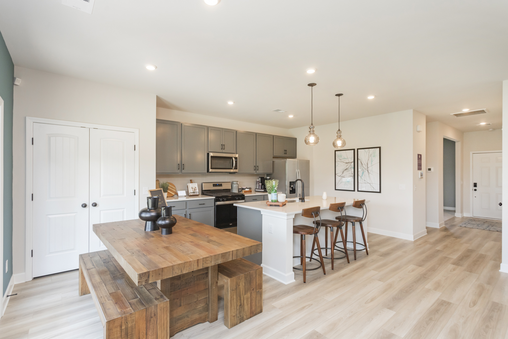 A kitchen with a wood floor.