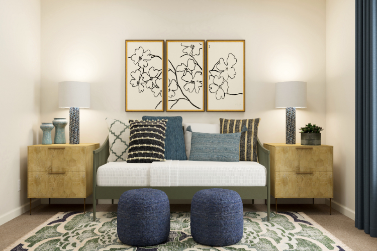 A couch with blue and white pillows.