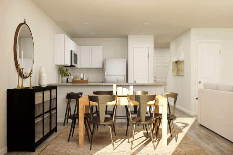 A kitchen with a dining table.