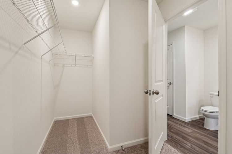 A bathroom with white walls.