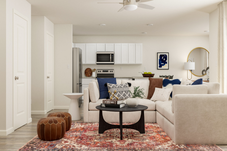A living room with white furniture.