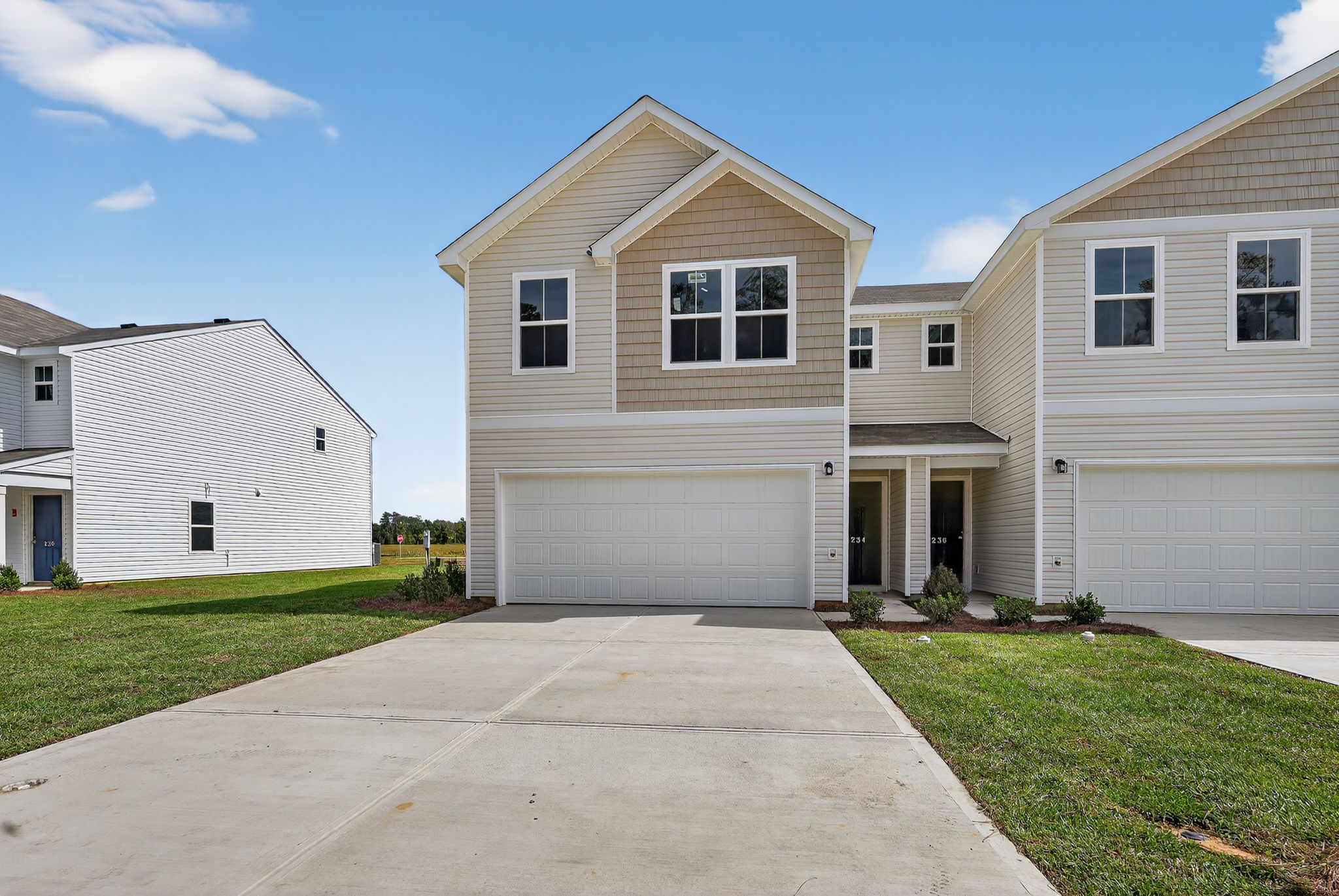 A driveway leading to a house.