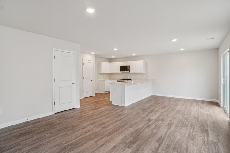 A room with white cabinets.